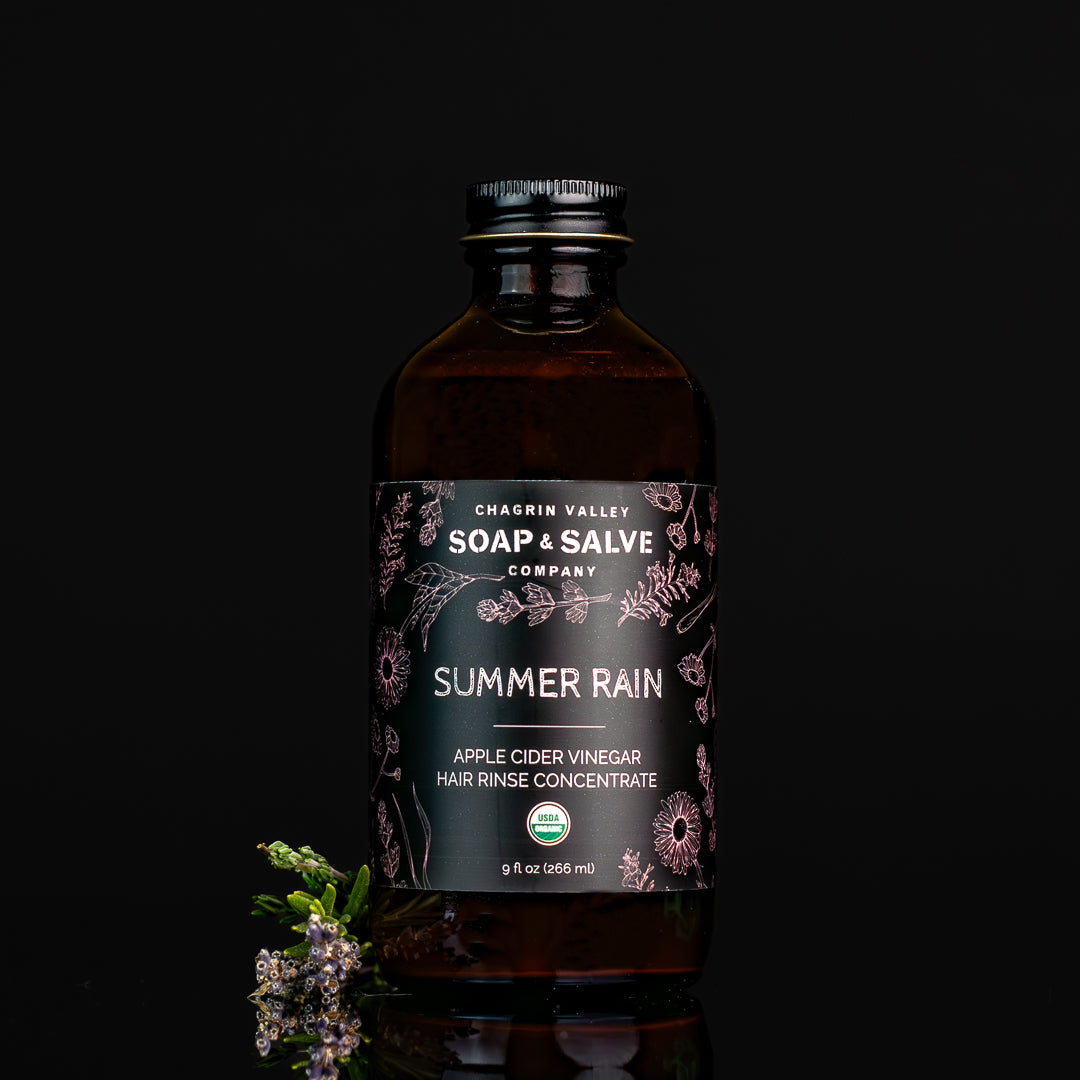 Summer Rain apple cider vinegar hair rinse concentrate in an amber bottle
