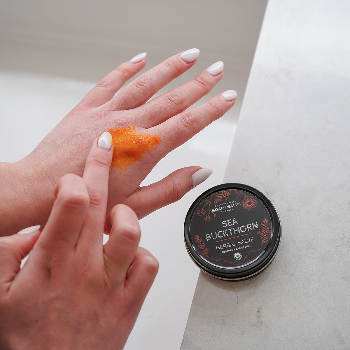 Organic Sea Buckthorn Salve in use