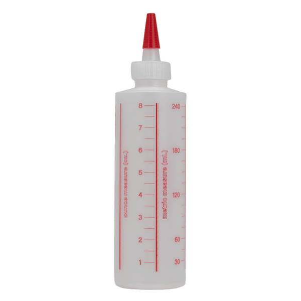 A translucent white squeeze bottle with a red pointed nozzle and red printed measurement markings on the side, shown against a plain white background.